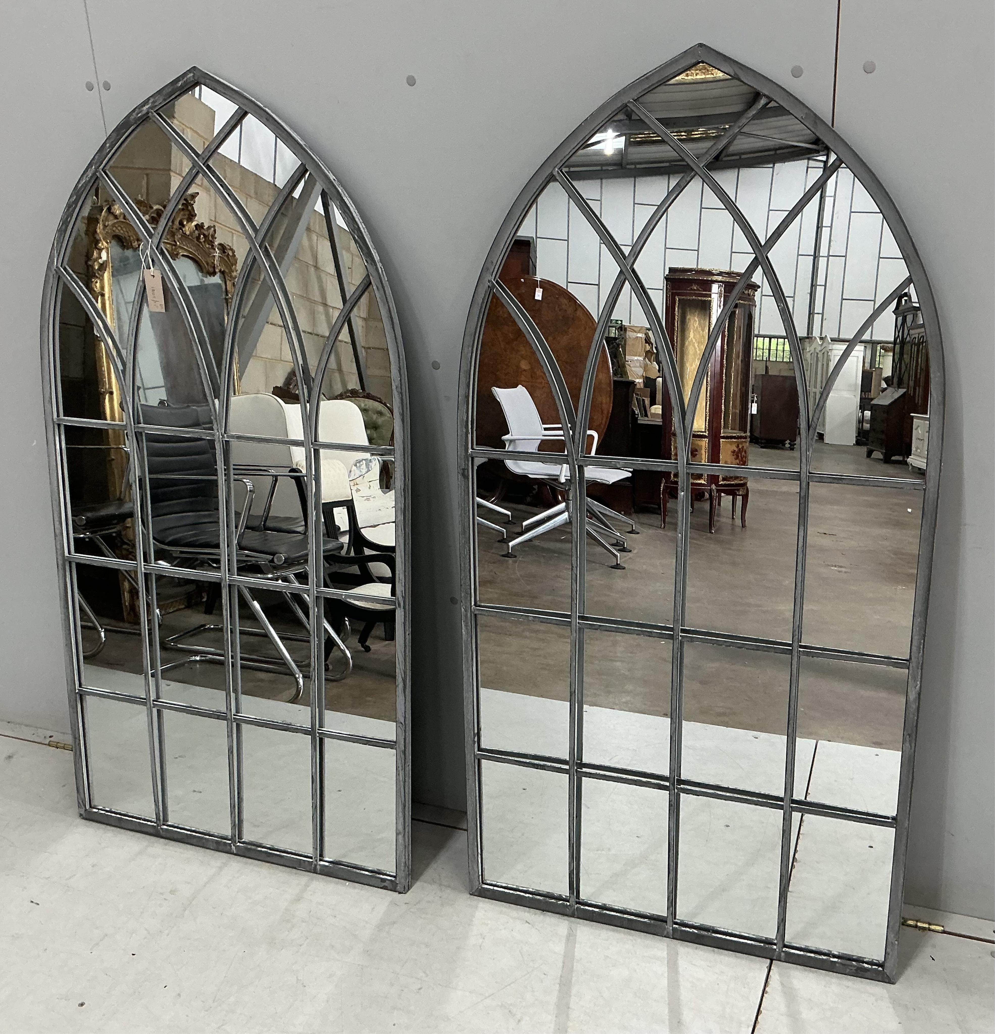 A pair of modern Gothic style arched window frame style wall mirrors, width 71cm, height 138cm